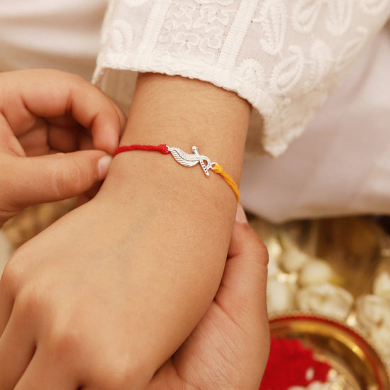 925 Silver-flute & peacock feather Rakhi for Kids